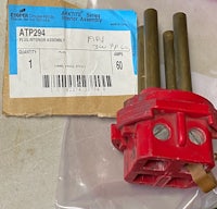 a red piece of plastic sits on top of a package